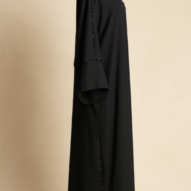 Side profile of black abaya showcasing flared sleeves and sequin embellishments – Zayrah modest wear